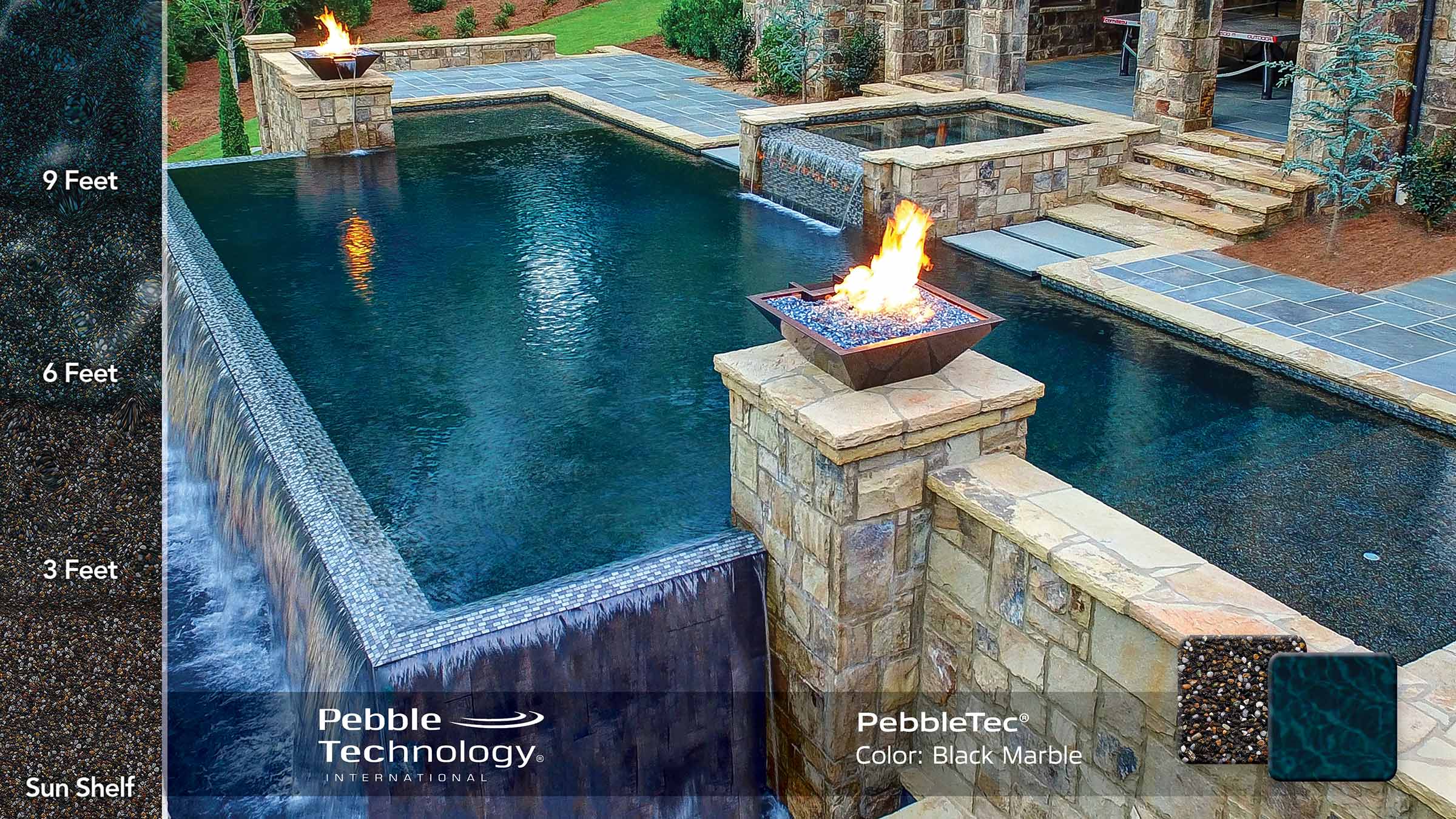 photo of backyard pool design with Fire and Water features in PebbleTec Black Marble Pool Finish: A rich blend of white pebbles and a subtle metallic luster produce a deep dark blue water color.