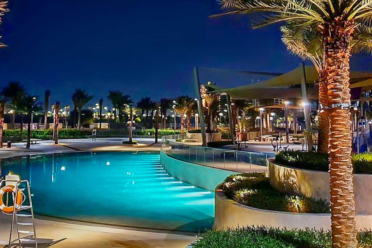 photo of Dubai Hills Park resort pool in PebbleTec Sandy Beach Pool Finish medium blue water color