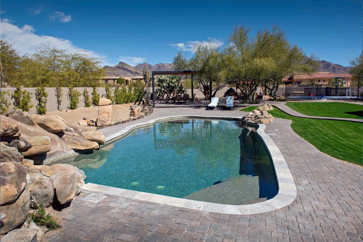photo of a backyard pool design in PebbleTec PebbleBrilliance Shoreline Pool Finish medium blue water color