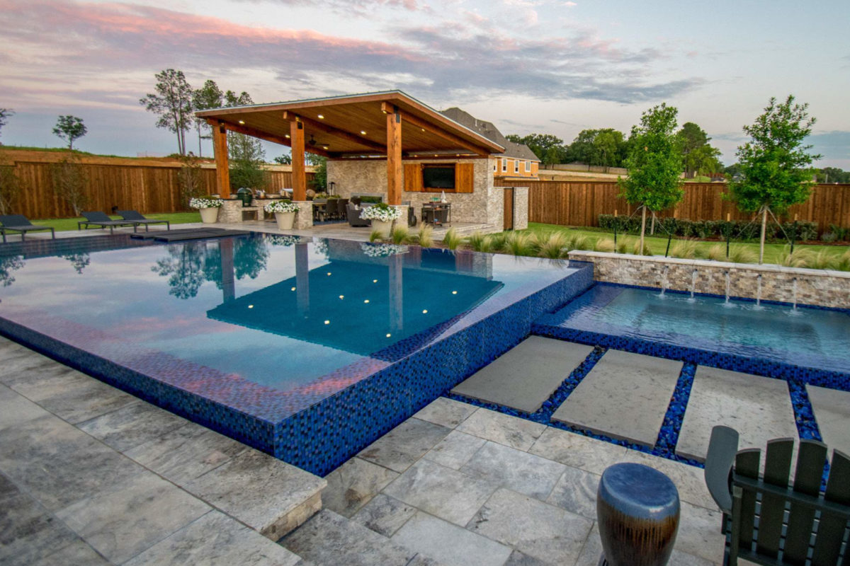 photo of a backyard pool design in PebbleTec PebbleBrilliance Aquafalls Pool Finish with lightstreams tile features in World's Greatest Pools 2017