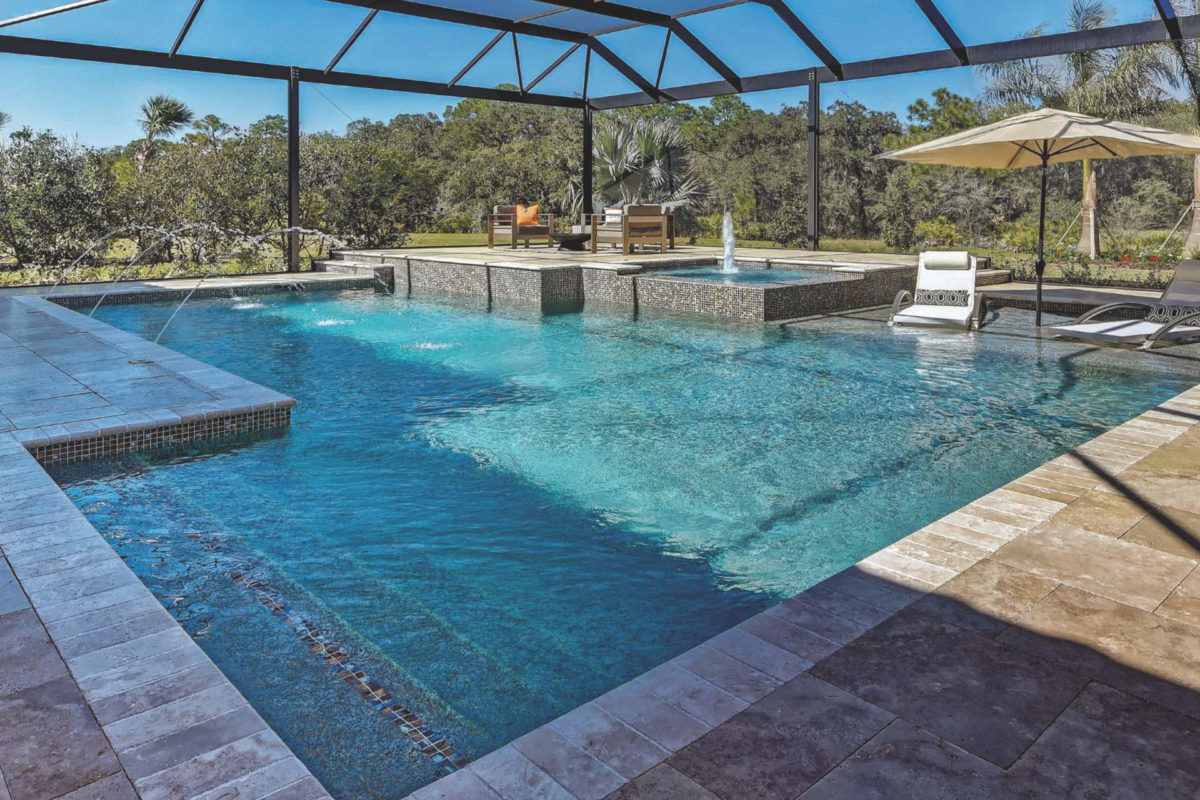 photo of an enclosed pool design in PebbleTec Caribbean Blue Pool Finish medium blue water color