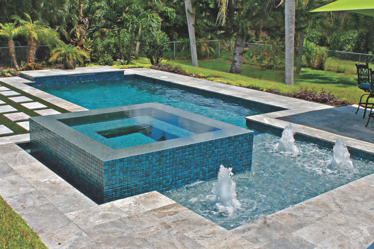 photo of a backyard pool design in PebbleTec Tropical Breeze Pool Finish with a jacuzzi and lightstreams tile features for World's Greatest Pools 2016