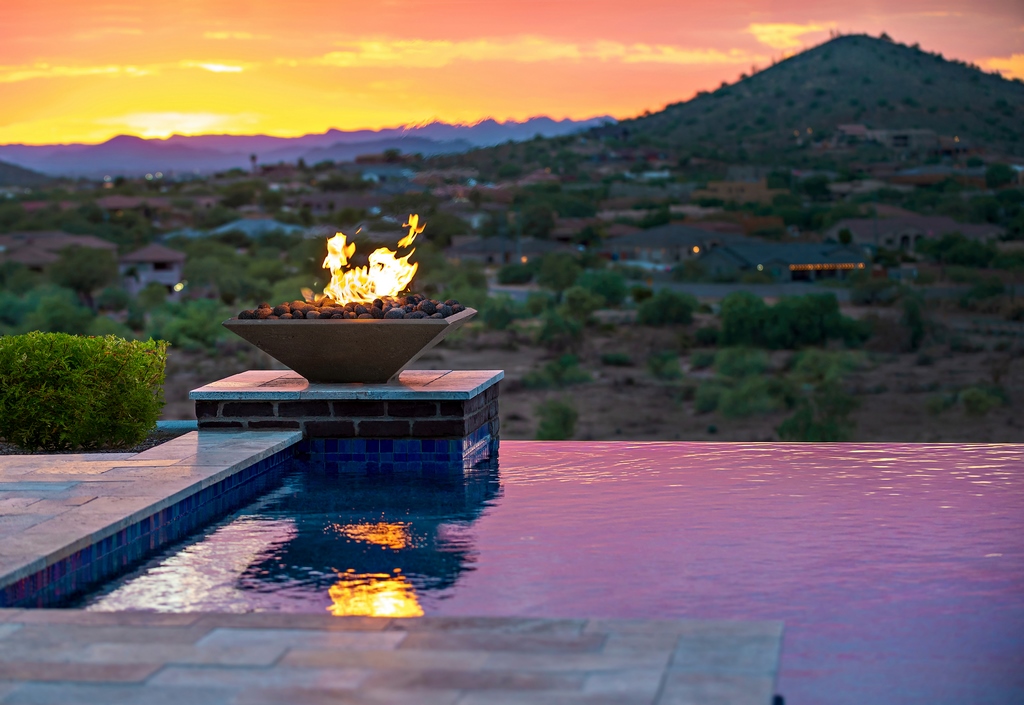 photo of waterfall pool with Fire Bowl feature by Earthcast in Burleson sunset Mountain View