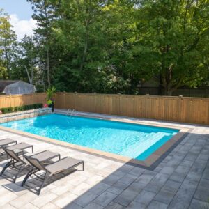 Pristine swimming pool setup in backyard