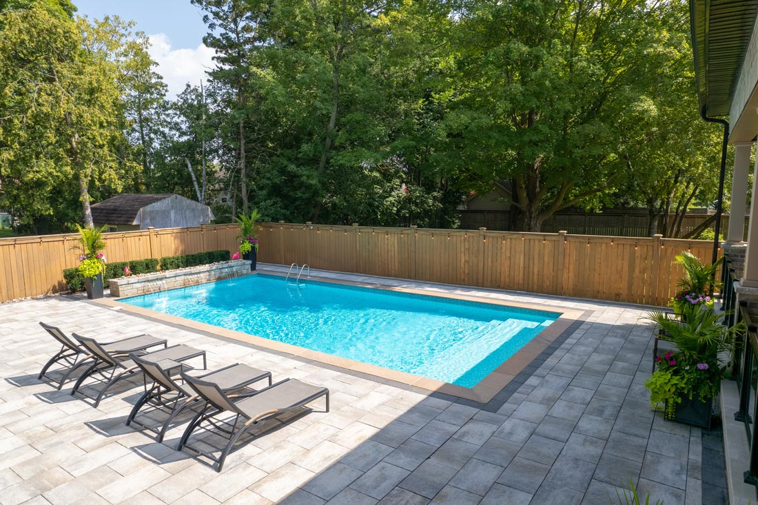 Pristine swimming pool setup in backyard