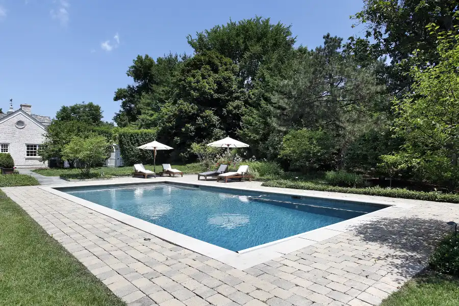 Residential pool in the back yard of luxury home.